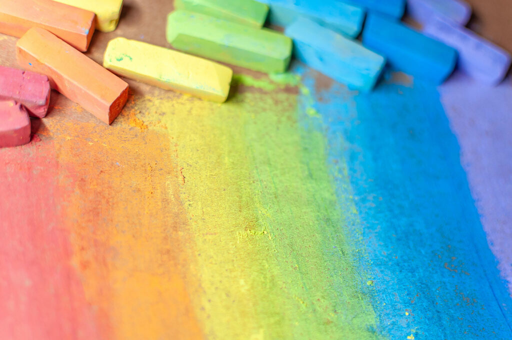 A rainbow palette of pastel crayons