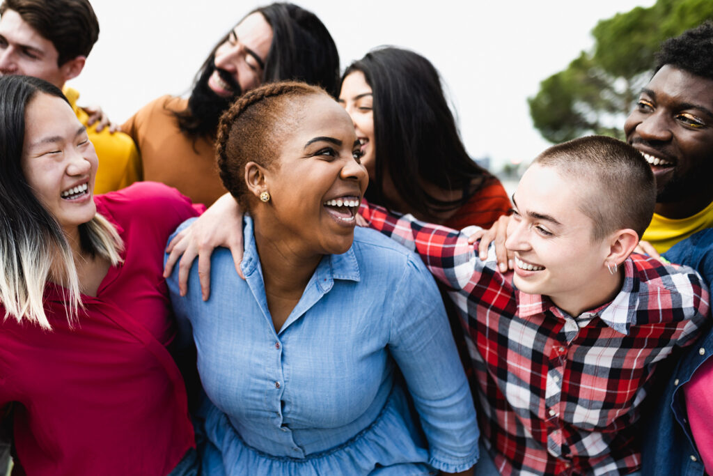 A group of diverse friends smiling and hanging out